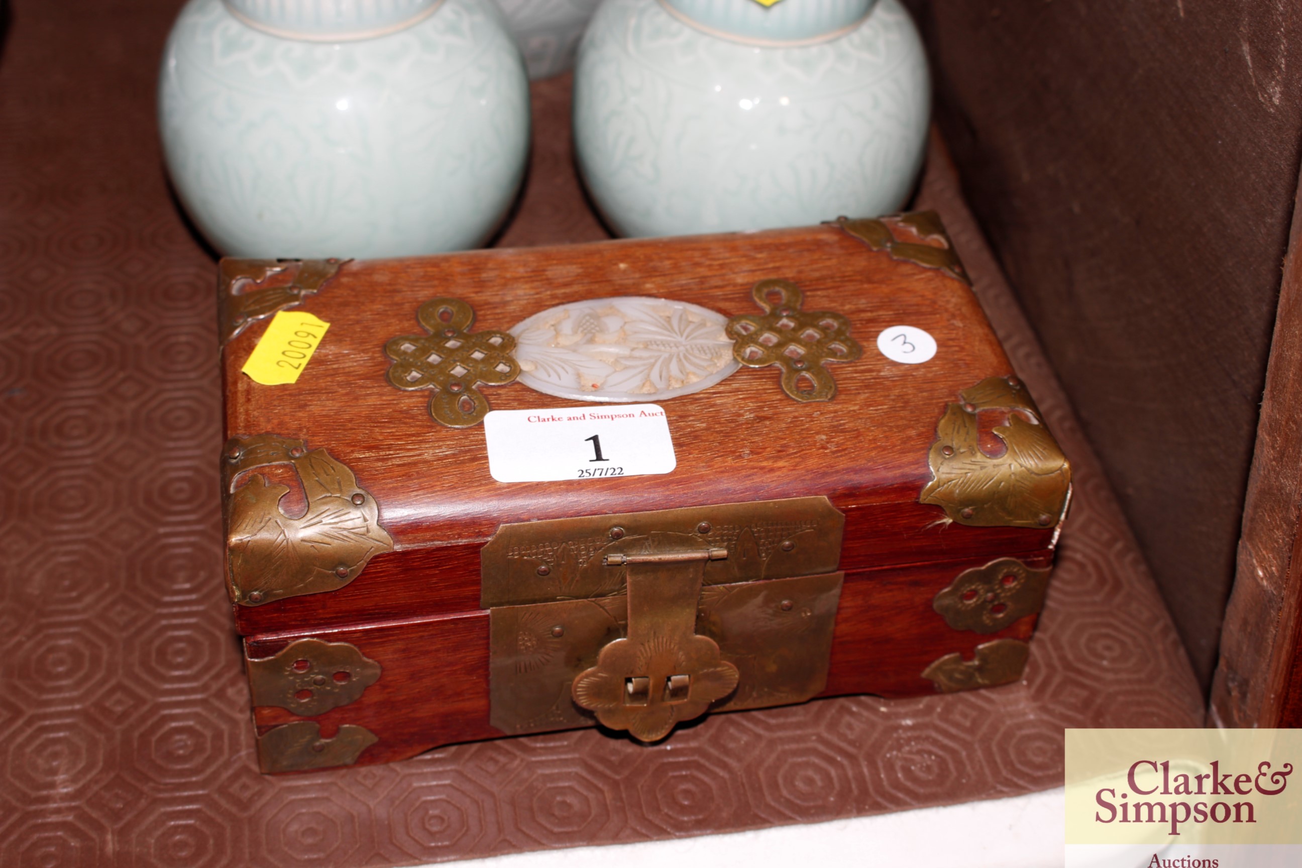 A Chinese wooden jewellery box with green stone in