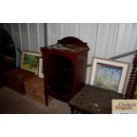 An Edwardian inlaid mahogany display cabinet