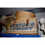 A wicker basket together with a wicker laundry bas