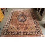 An approx. 8' x 6'7" red and blue patterned rug