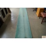 An approx. 11'6" x 2'4" patterned runner