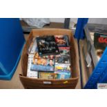 A box of various DVD's