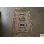 An approx. 4'3" x 2'3" patterned rug