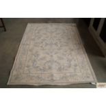 A Laura Ashley blue and cream patterned rug