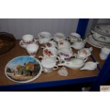 A quantity of feeding mugs and collectors plates a