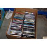 A box of various CDs