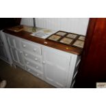 An Ercol Colonial sideboard with a wax top and gre