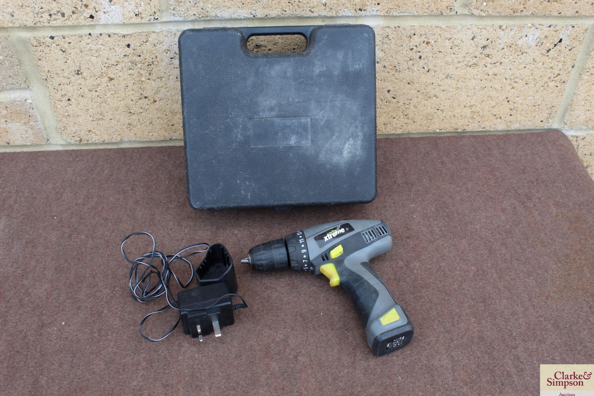 Challenge Xtreme PT100116 10.8v cordless drill with battery and charger in case.