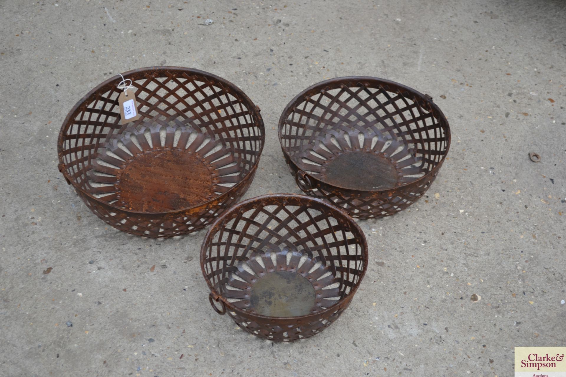 Three graduated pierced metal lattice bowls. V