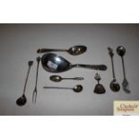A collection of various eastern white metal spoons
