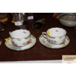 A pair of Herend porcelain cups and saucers