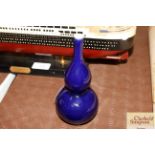 A Chinese deep blue monochrome double gourd vase,