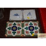 Two antique delft blue and white tiles; and two Mi