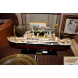 A painted model of RMS Titanic on stand