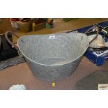 A small oval galvanised planter (22)