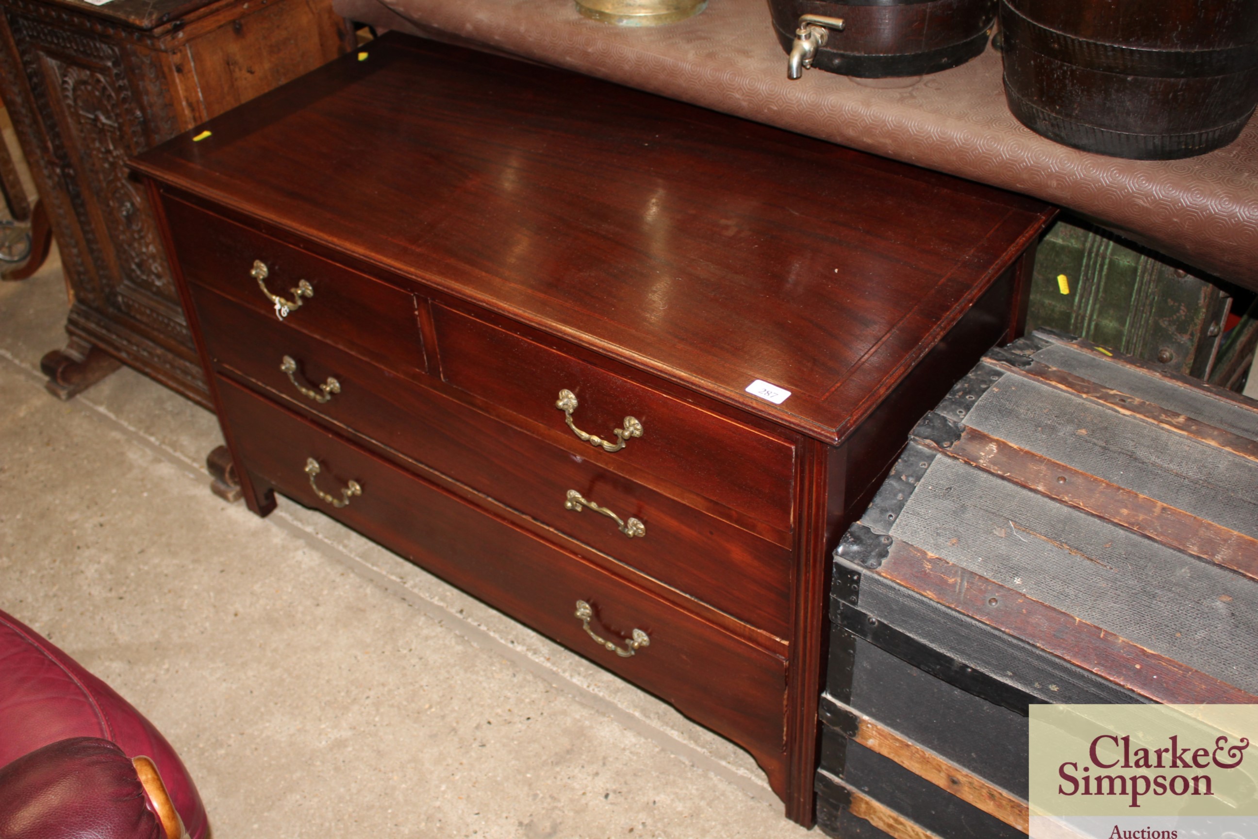 A mahogany and satin wood banded chest of two shor