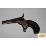 An antique purse pistol