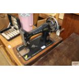 A Singer sewing machine (no case)