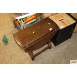 An oak drop leaf coffee table