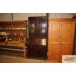 A 1930's oak and leaded glazed bureau bookcase