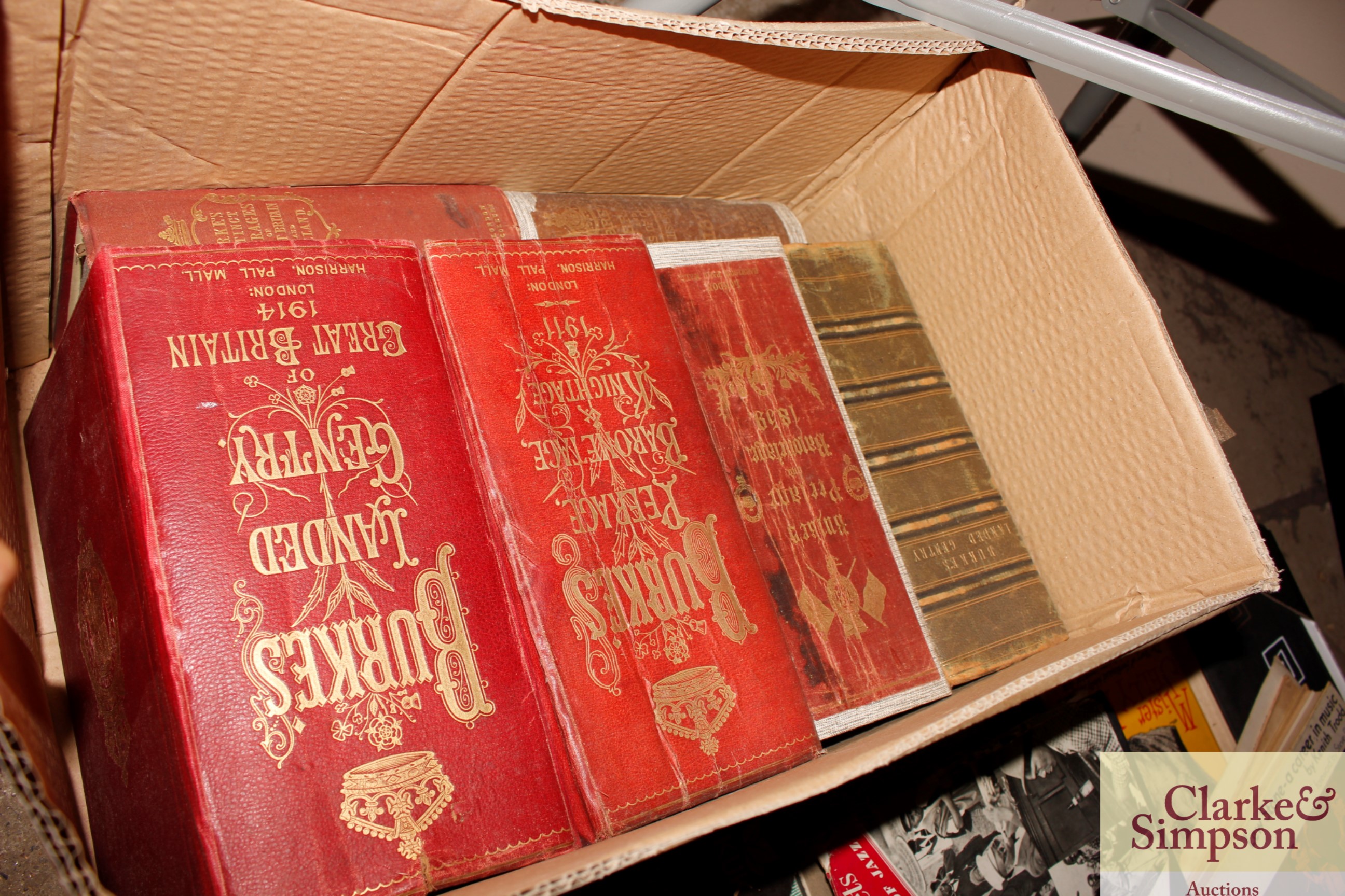 A box containing various volumes of Burkes Peerage