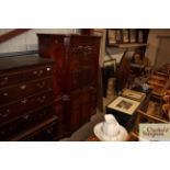 A reproduction mahogany breakfront bookcase