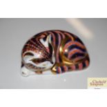 A Crown Derby paperweight in the form of a cat wit