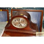 An oak cased chiming mantel clock