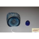 A small blue glass etched paperweight and a mineral