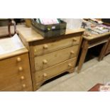 A stripped pine chest of three drawers