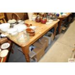 A stripped pine kitchen table