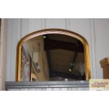 A gilt framed overmantel mirror