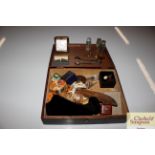 A wooden box and miscellaneous contents to include
