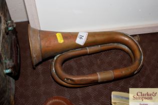 An antique copper and brass bugle