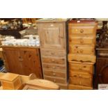 A stripped pine cabinet with draws and cupboards u