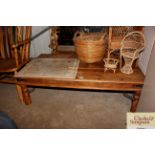 A rustic pine and metal studded coffee table