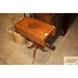 A brass inlaid and drop leaf occasional table