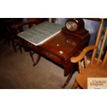 A reproduction mahogany sofa table