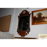 A mahogany framed Chippendale style wall mirror wi