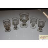 A large Victorian glass rummer and four smaller ru