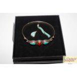 A Sterling silver turquoise and coral bangle; and