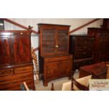 A 19th Century mahogany bookcase on cabinet