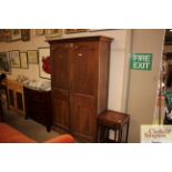 An early 20th Century oak storage cupboard