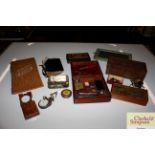 A box of vintage items including a pocket watch, o