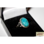 A silver and turquoise set ring size L/M