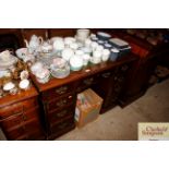 An Edwardian mahogany twin pedestal desk with green leather inset