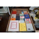 A box of various vintage playing cards mostly in o