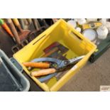 A quantity of long handled garden tools and a box