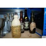 Two vintage glass Adnams bottles, a Cobbold bottle, together with a Lawrence & Sons stoneware
