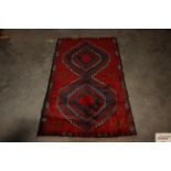 An approx. 2'7" x 4'7" Bolochi rug